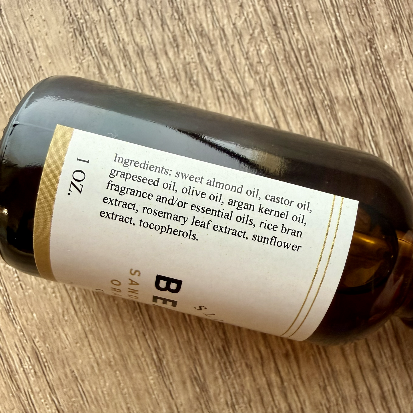 Bottle with a label on a wooden surface